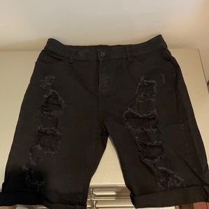 Black distressed shorts.